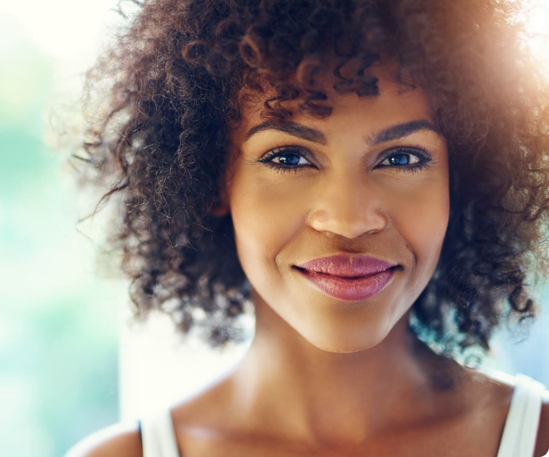 a close up of a person with a smile on her face